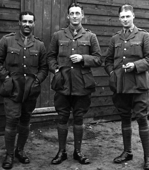 Ex-Tottenham player Walter Tull (left) with fellow officers in 1917. He served as an officer in Italy and France & was killed in action