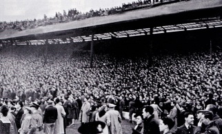 Scenes reminiscent of the 1923 FA Cup Final as the huge crowd spills onto the Chelsea pitch